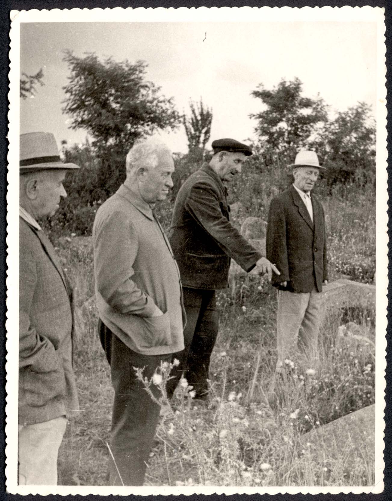 Holocaust survivors at the murder site near Basalychevka village